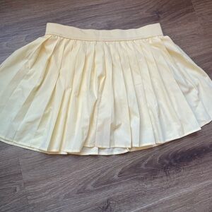 No Boundaries Pleated Yellow Mini Skirt